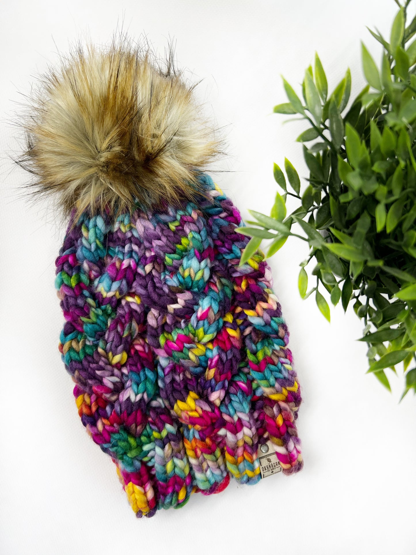 Beautifully soft 100% Hand Dyed Merino Wool knitted toque. Hand Knit in Shits and Giggles colourway with Pink, Blue, Yellow and Purple - Okanagan Dye Works